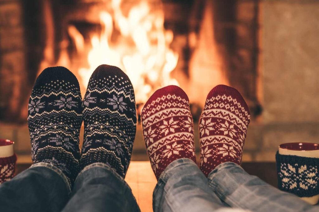 Cosy socks by the fire with hot chocolate